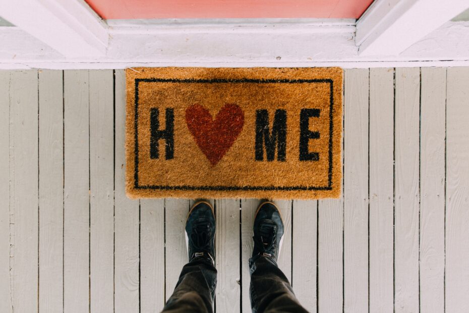 Welcome mat that says "Home"